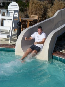 Man sliding into pool