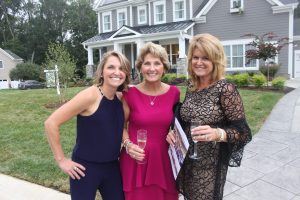 Ladies in front of home