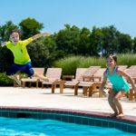 Kids jumping in pool
