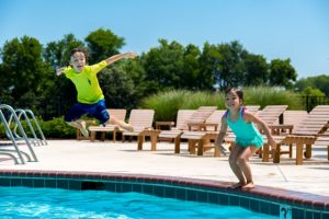 Kids jumping in pool